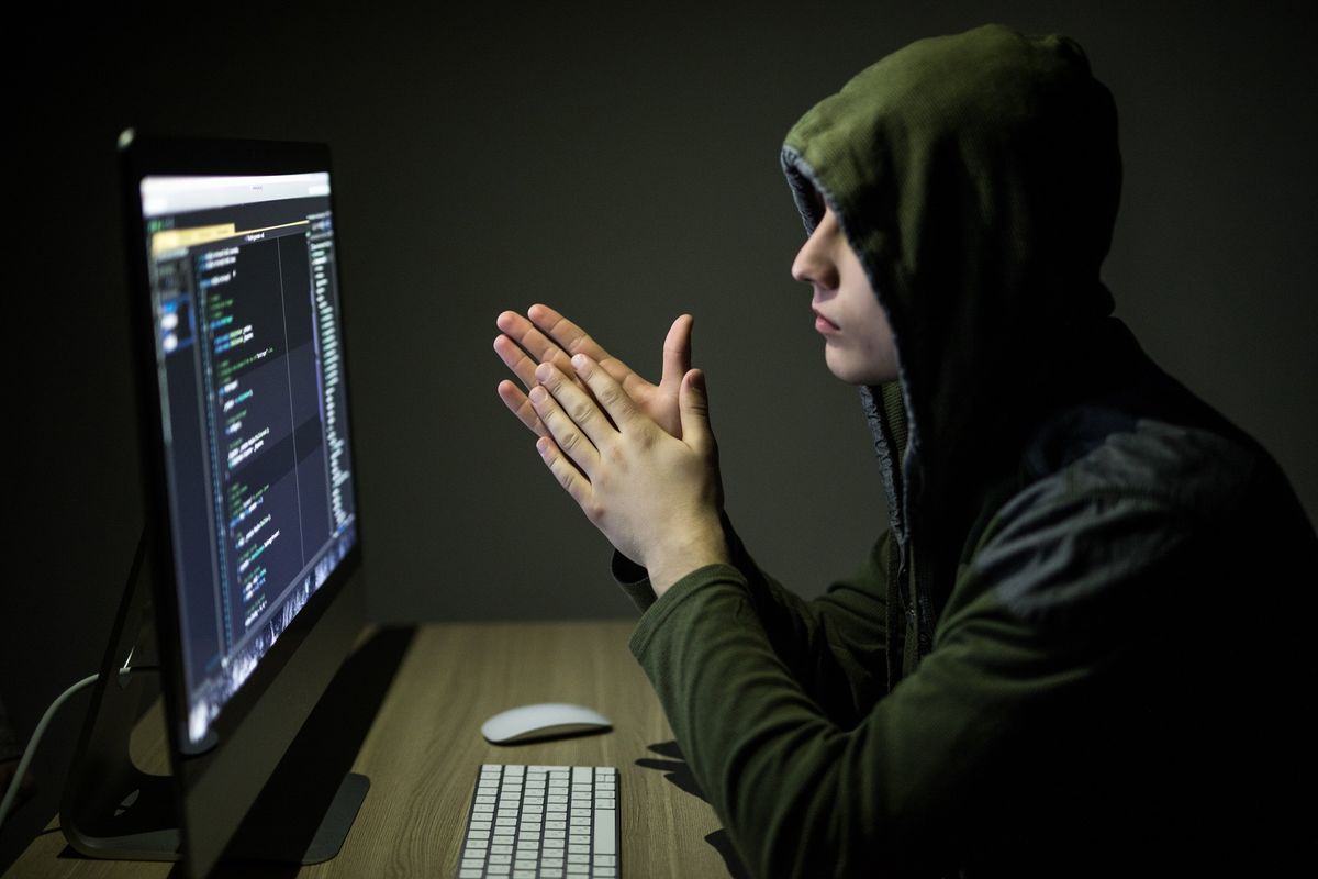 Hacker,In,Glasses,Breaking,Code.,Criminal,Hacker,Penetrating,Network,System