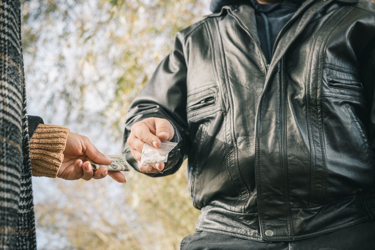 Male,Drug,Dealer,Sells,Hard,Drugs,In,A,Transparent,Plastic